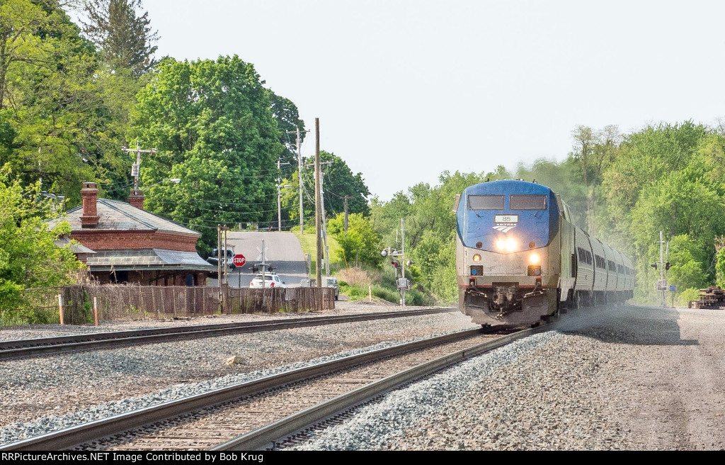 AMTK 85 leads the westbound Maple Leaf past the brick ex-NYC depot in Stuyvesant, NY